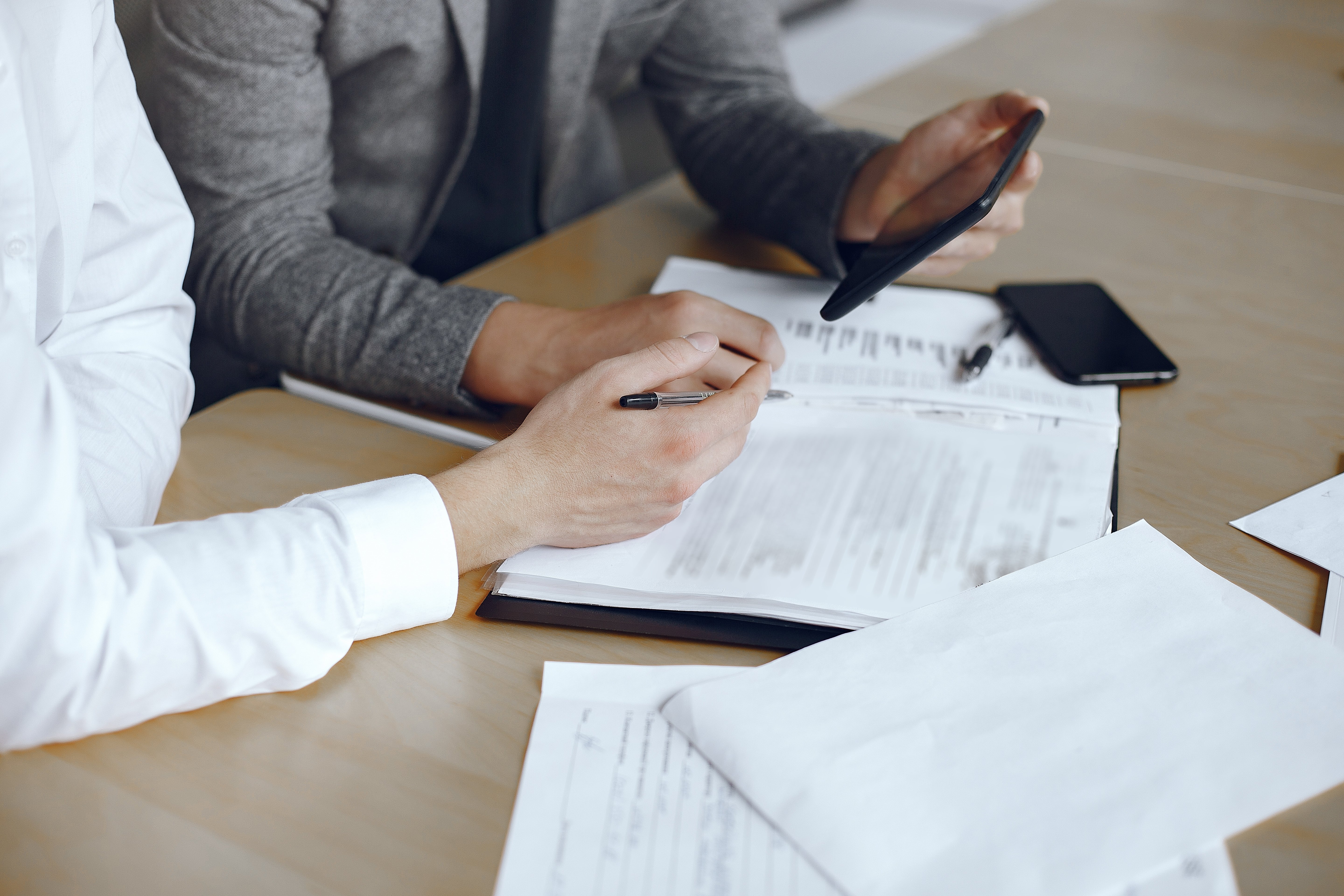 business-men-sitting-lawyers-s-desk-people-signing-important-documents