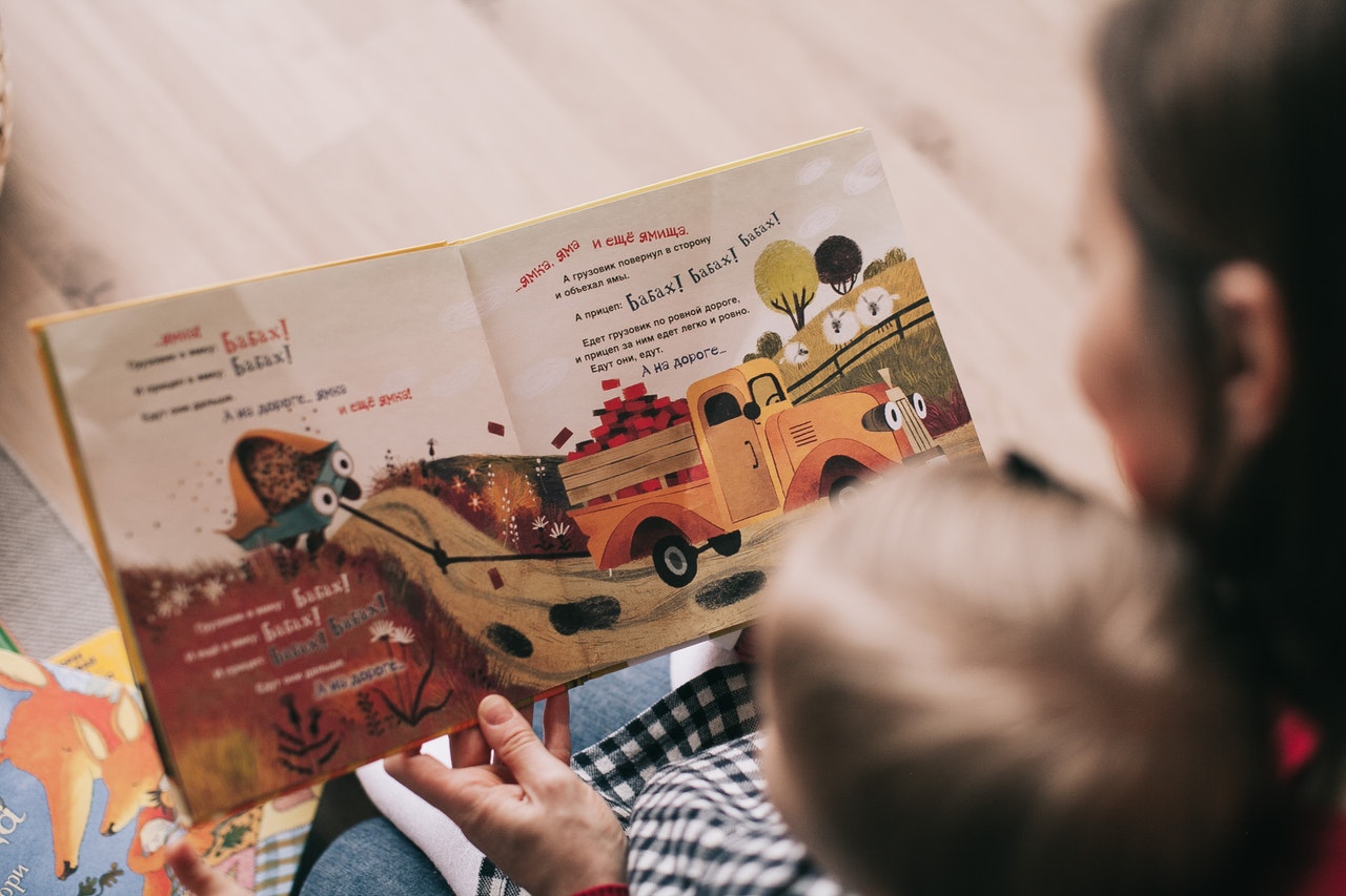 woman-reading-book-to-toddler-1741231